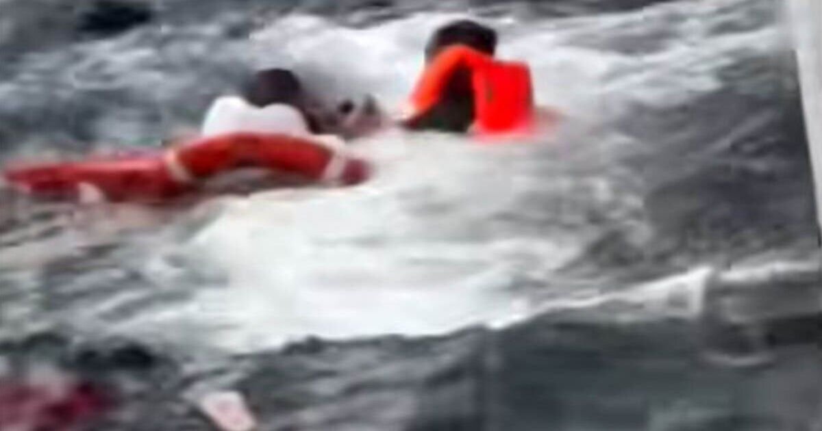 Dramatic-moment-luxury-cruise-ship-rescue-small-boat-migrants.jpg
