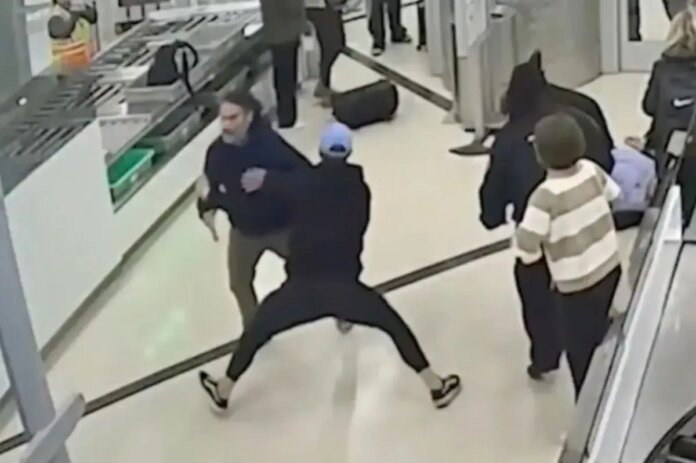 Atlanta-airport-passenger-Mark-Thomas-bodyslams-TSA-breach-suspect-Fabian.jpg