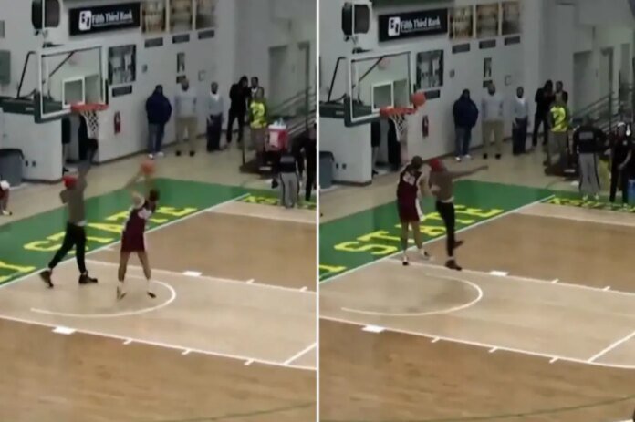 Fan-runs-onto-court-to-stop-shot-attempt-in-wild.jpg
