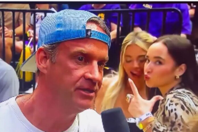 Livvy-Dunne-photo-bombs-interview-with-LSU-coach-Lane-Kiffin.jpg