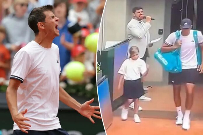 Tennis-star-Rafael-Jodar-leaves-child-mascot-hanging-in-another.jpg
