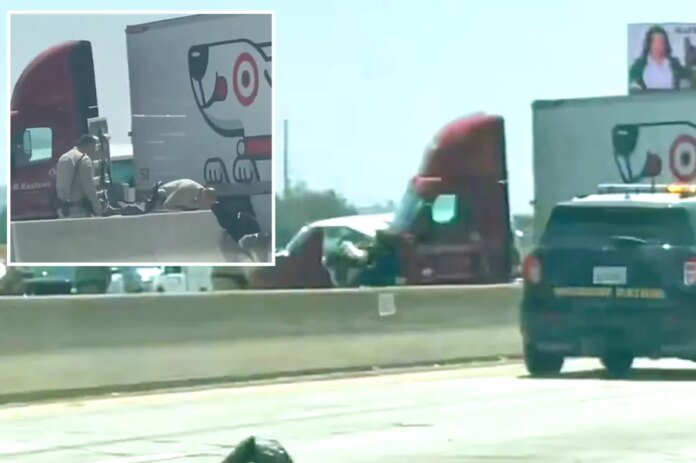 1-Dead-32-injured-after-semi-truck-crosses-center-divider-in.jpg