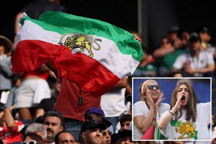 Iranian-World-Cup-soccer-fans-wave-pre-revolutionary-flag-inside-stadium.jpg